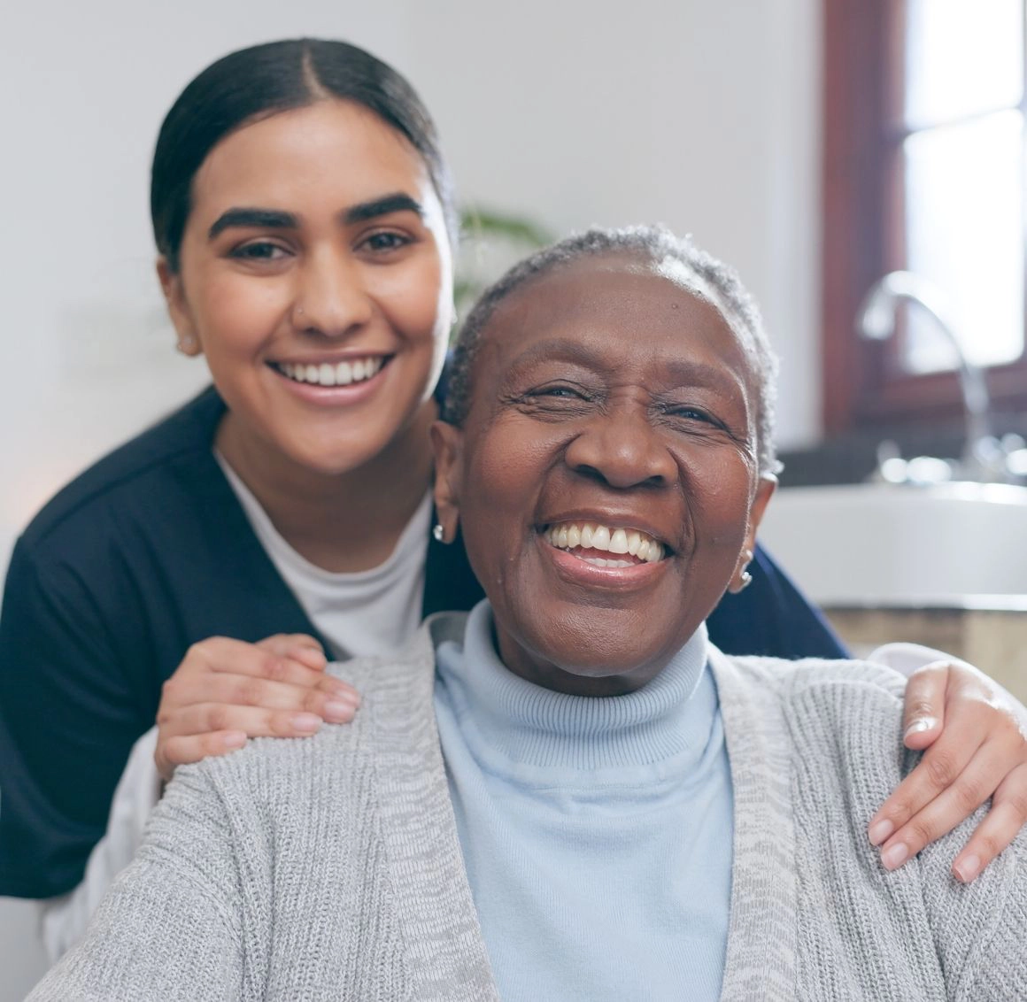 caregiver smiling with senior