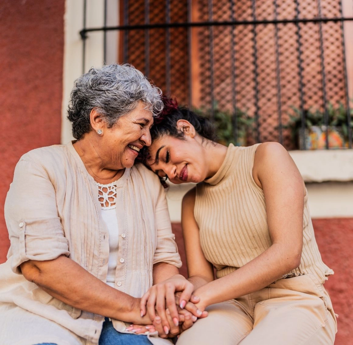 Caregiver assisting an older woman during an outdoor walk Caregiver assisting an older woman during an outdoor walk