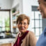 Caregiver provides attentive senior care as part of diabetes awareness